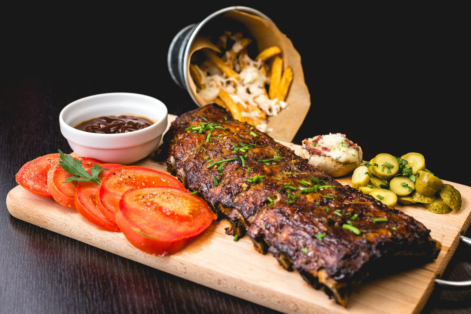 Argentine asado with a glass of red wine on a wooden table