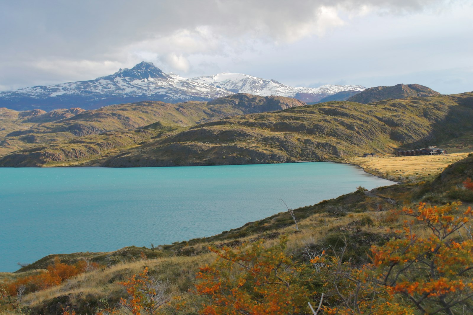 A still Patagonian lake ringed by mountains, near the Río Negro wine valleys