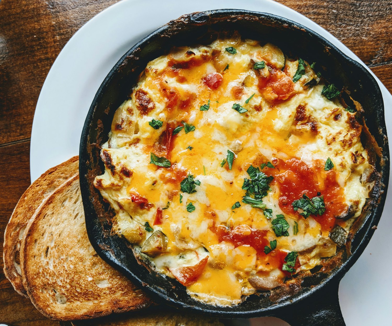 Melted golden cheese on a small skillet, asado-style provoleta