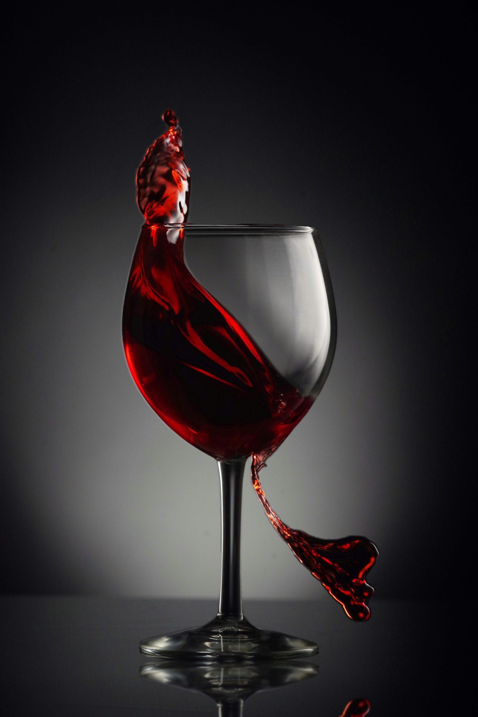A glass of deep, dark red Syrah