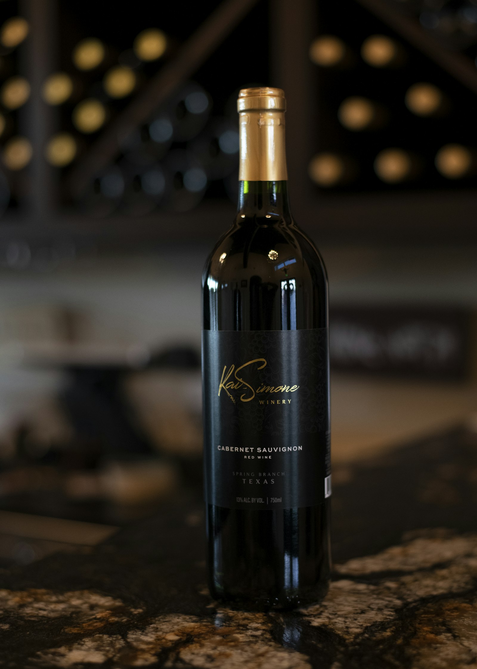 A single wine bottle with a clearly readable label showing producer, grape, region and ABV